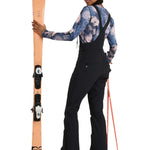 Roxy Women's Summit Bib Shell Pant 2025 - A black bib shell pant with a white logo on the left thigh and a zippered pocket on the right side.