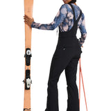Roxy Women's Summit Bib Shell Pant 2025 - A black bib shell pant with a white logo on the left thigh and a zippered pocket on the right side.