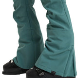 Roxy Women's Rising High Pant 2025 - A pair of teal-colored snow pants with a subtle pattern and zippered pockets.