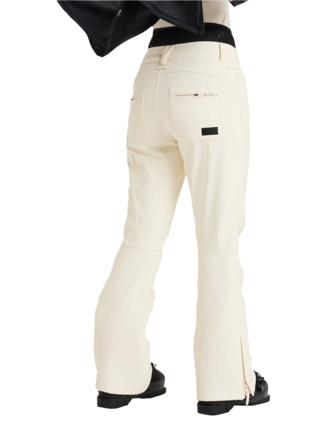 Roxy Women's Rising High Pant 2025 - A pair of cream-colored snow pants with a zippered pocket on the back right side.