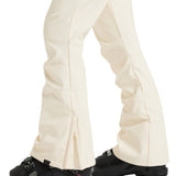 Roxy Women's Rising High Pant 2025 - A pair of cream-colored snow pants with a subtle pattern and zippered pockets.