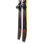 Dynafit Tigard 107 Flat Ski 2025 - A pair of black skis with orange accents and a distinctive tiger logo on the tip.