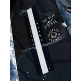 Whitespace Freestyle Shaun White Pro Limited Edition Snowboard 2023 - A black snowboard with white lettering and a white stripe down the middle.