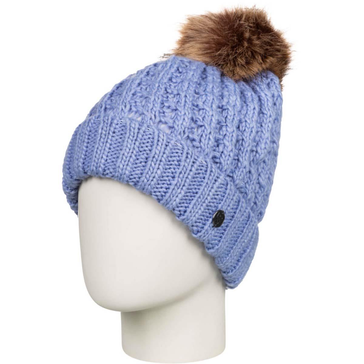 Roxy Junior's Blizzard Beanie 2023 - A light blue beanie with a brown faux fur pom-pom on top.