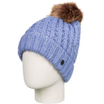 Roxy Junior's Blizzard Beanie 2023 - A light blue beanie with a brown faux fur pom-pom on top.