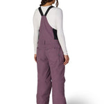 Women’s insulated bib overalls, mauve purple, back view with full suspenders and leg vents.