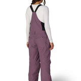 Women’s insulated bib overalls, mauve purple, back view with full suspenders and leg vents.