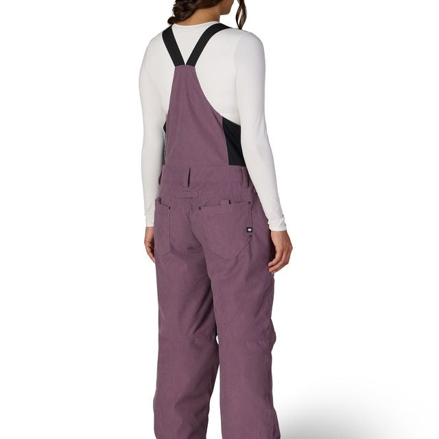 Women’s insulated bib overalls, mauve purple, back view with full suspenders and leg vents.
