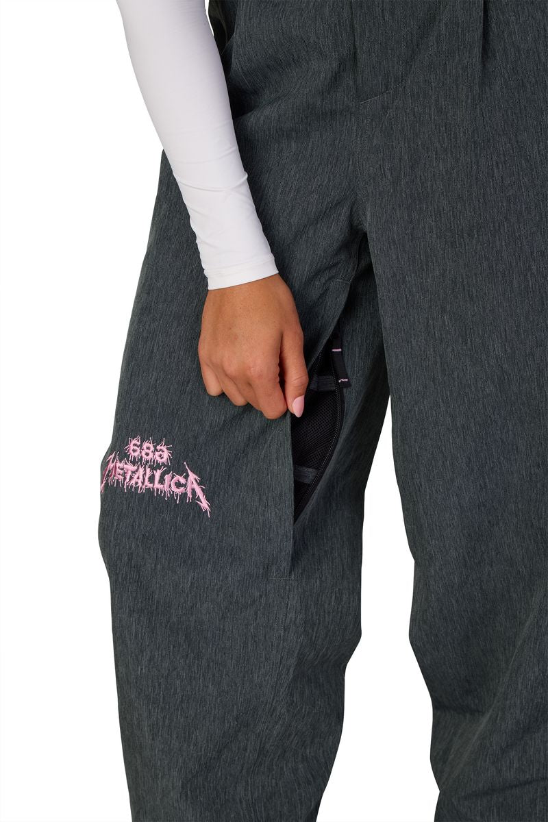Women's dark gray shell pants with Metallica graphic patch and side pocket