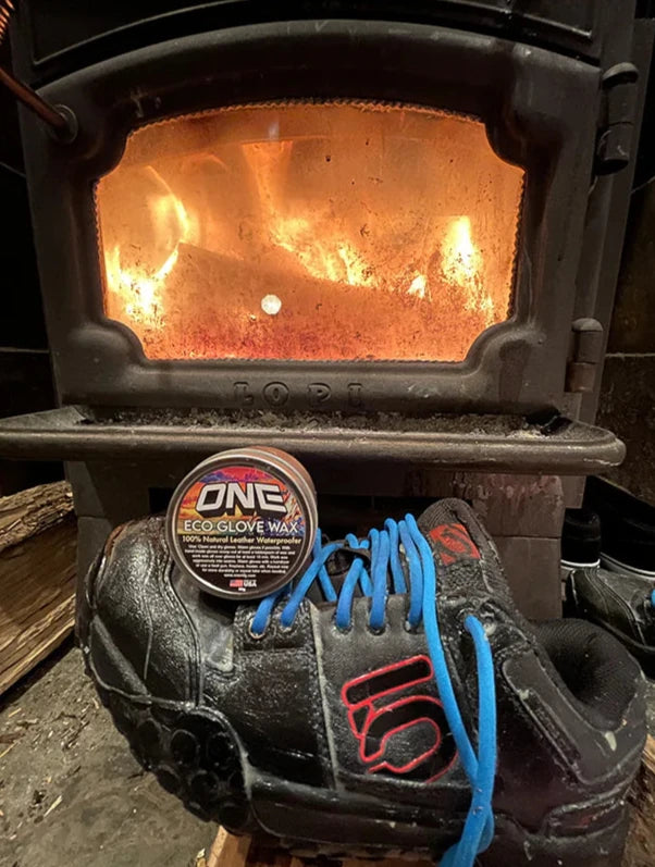 Oneball Leather Waterproofing Glove Wax - A small round tin of dark brown wax with a label that says "ONE" in white letters and "ECO GLOVE WAX" in smaller text below.