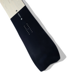 Arbor GPS Snowboard 2026 - A light-colored wood grain patterned snowboard with a black logo on top and white lettering below it.
