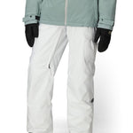 White cargo pants with adjustable cuff hem and side pockets; paired with outerwear