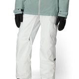 White cargo pants with adjustable cuff hem and side pockets; paired with outerwear