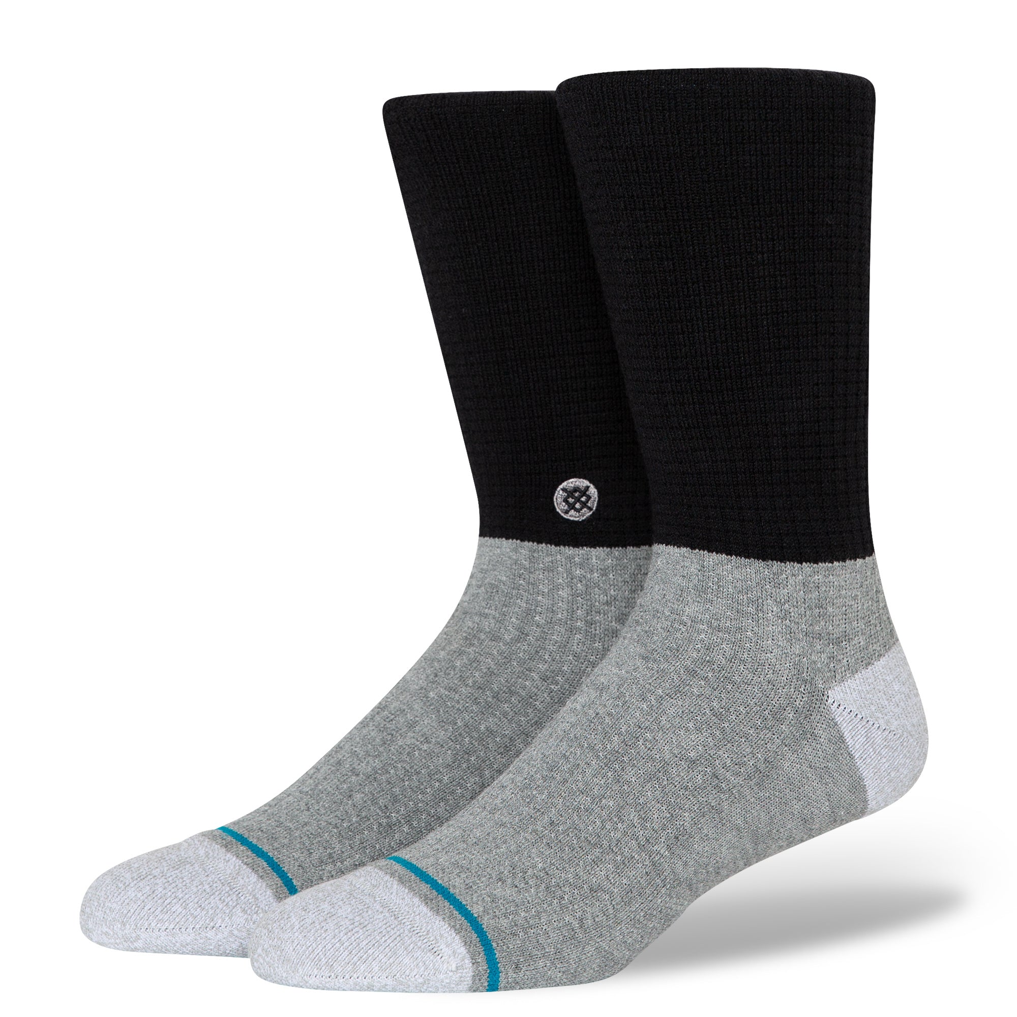 Stance Head Block Crew Sock 2024 - A pair of crew socks with a black and grey color block design, featuring a small white logo on the ankle cuff.