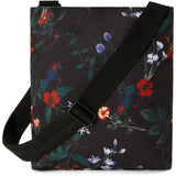 Dakine Jo Jo Crossbody Bag 2025 - A black crossbody bag with a floral pattern of red, white, and purple flowers.