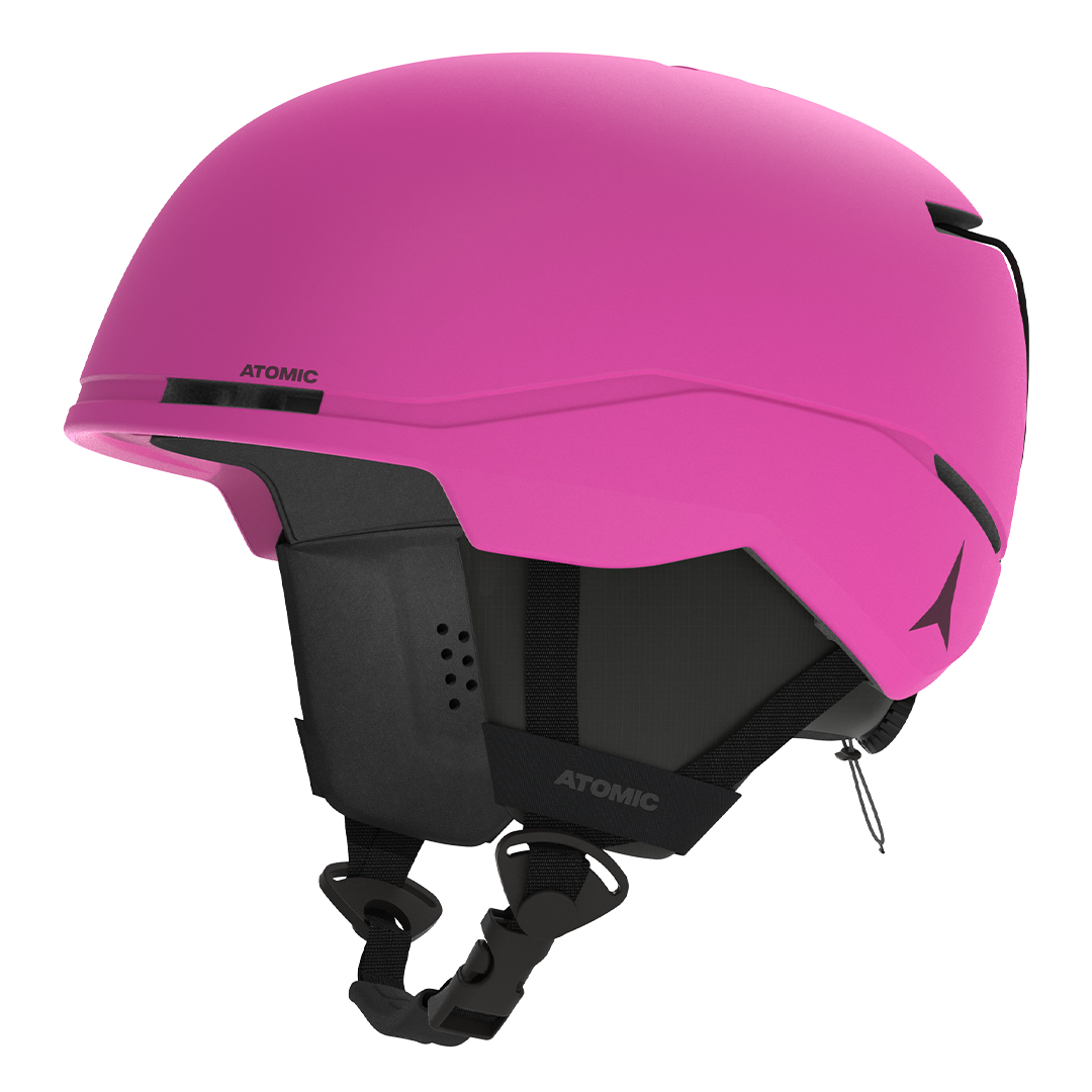 Atomic Junior Four Helmet 2026 - A pink helmet with a black chin strap and ventilation holes on top.