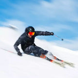 K2 Disruption MTI skis with MXC 12 bindings cut through fresh powder, showcasing a vibrant red and white design.