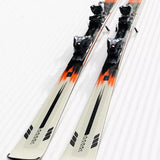 K2 Disruption MTI skis with MXC 12 bindings feature a white and black design.