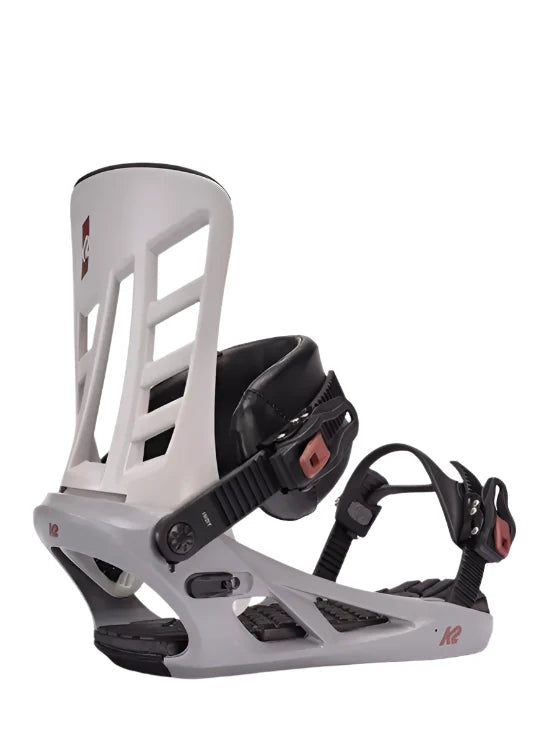 K2 Indy 2025 snowboard binding features a white base with red accents and black straps.