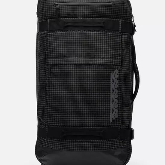 K2 Luggage roller bag, black with a grid pattern, features durable wheels and reinforced handles.