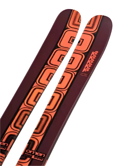 K2 Women's Omen 90 skis 2025 feature a red and black design.