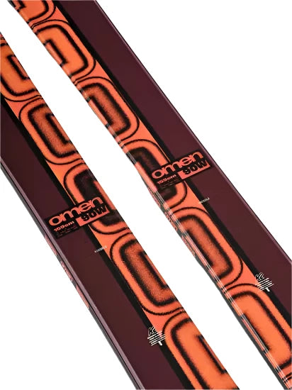 K2 Women's Omen 90 skis 2025 feature a distinctive red and black graphic design.