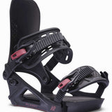 K2 Albany snowboard binding features a black base with pink accents and a distinctive design.
