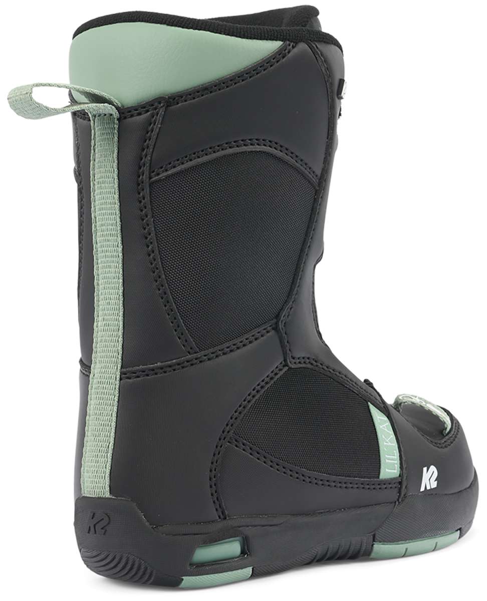 Black K2 Lil Kat youth snowboard boots feature green accents and a distinctive design.