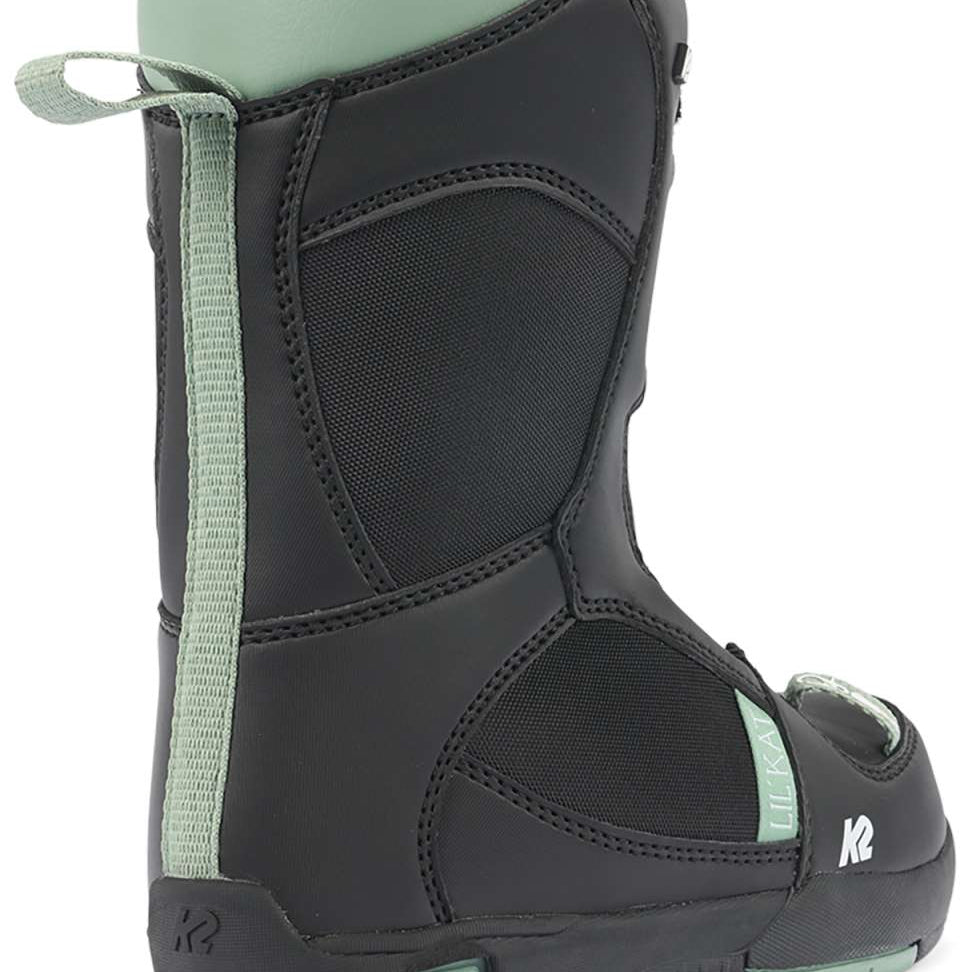 Black K2 Lil Kat youth snowboard boots feature green accents and a distinctive design.