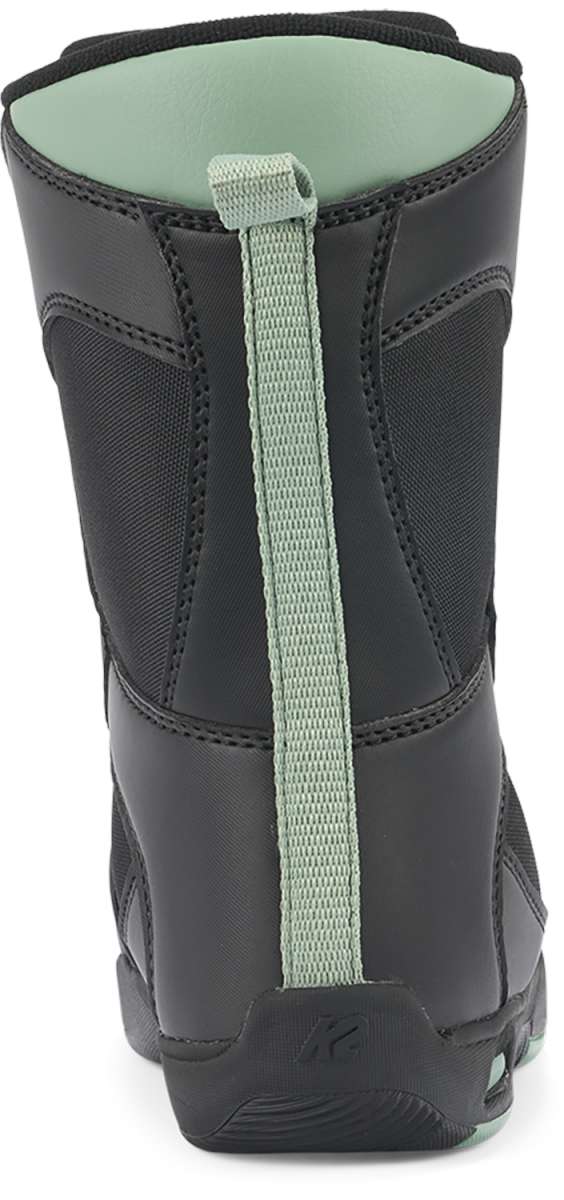 Black K2 Youth Lil Kat snowboard boot with a green pull tab and textured sole.