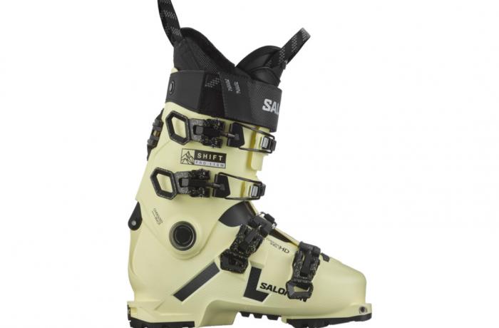 Salomon Women's Shift Pro 110 Ski Boots - A pair of women's ski boots with a black strap and buckle on top, featuring a white logo that reads "SHIFT PRO".