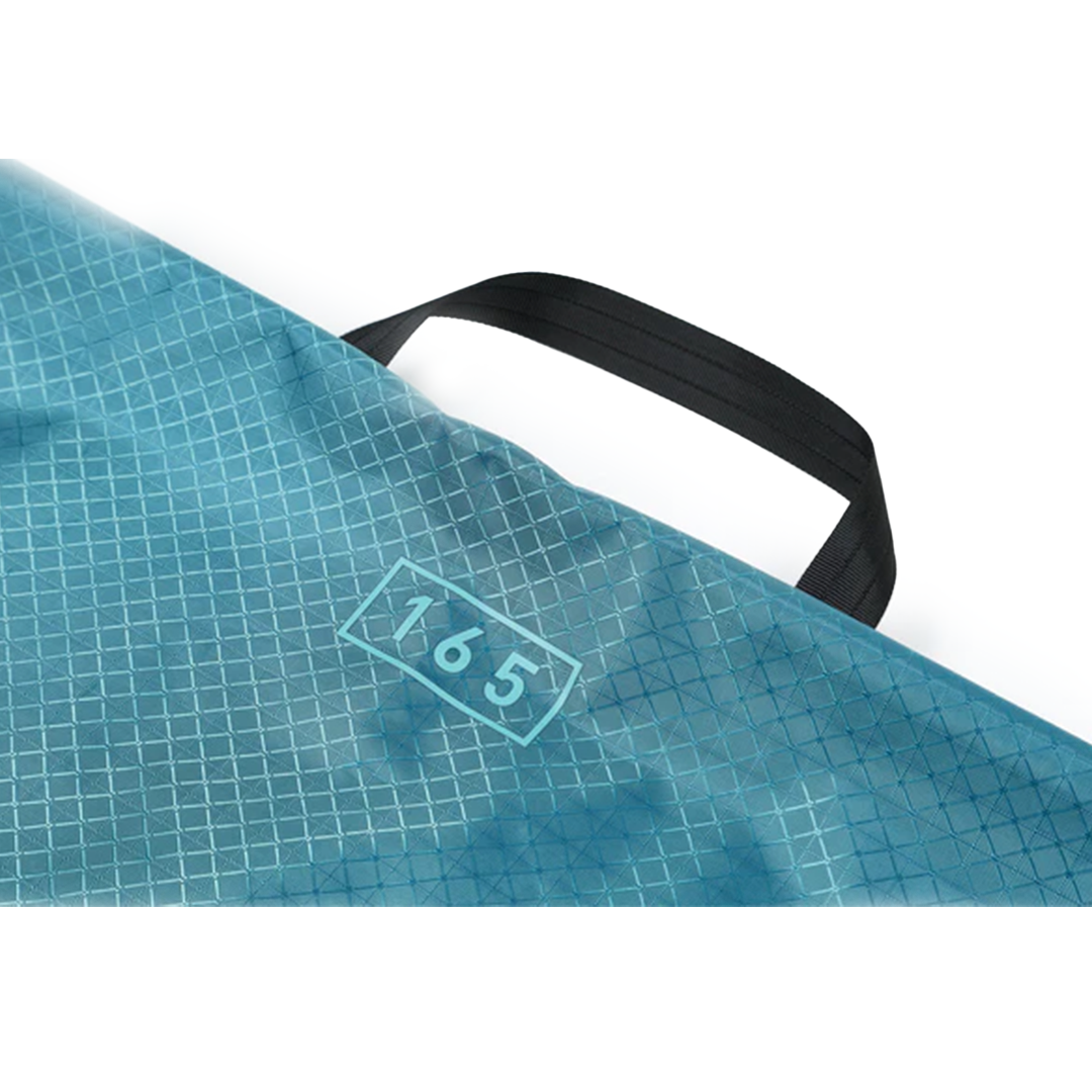 Nitro Light Sack Snowboard Bag 2026 - A light blue snowboard bag with a grid pattern and black handle.