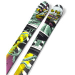 Line Bacon 108 Ski 2025 - A pair of skis with a white base and black bindings, featuring a graphic design in shades of green, yellow, and pink.