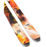 Line Pandora 106 Skis 2025 - A pair of skis with a predominantly white base and a vibrant, multicolored pattern featuring shades of orange, green, yellow, and pink.
