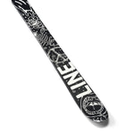Line Junior's Ruckus Skis 2025 - Black skis with white line art illustrations of a smiling sun, mountains, and a snowboarder.