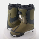 DC Transcend BOA Snowboard Boots 2024 - A pair of olive green snowboard boots with black accents and a white sole, featuring a BOA closure system on the right boot.