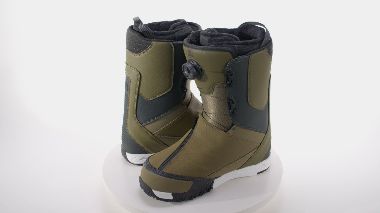DC Transcend BOA Snowboard Boots 2024 - A pair of olive green snowboard boots with black accents and a white sole, featuring a BOA closure system on the right boot.