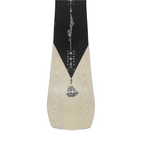 Jones Flagship Pro Snowboard 2025 - A black snowboard with a white logo and text on top of a light-colored wood grain background.