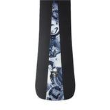 Jones Mind Expander Snowboard 2025 - A black snowboard with a white and blue abstract design, featuring a skull graphic on its bottom edge.