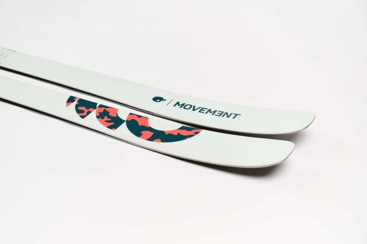 Movement Women's Fly 95 Skis 2024 - White skis with a black and pink logo on top.