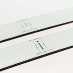 Movement Women's Fly 95 Skis 2024 - White skis with black bindings and a black stripe down the middle.