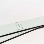 Movement Women's Fly 95 Skis 2024 - White skis with black bindings and a green logo on top.