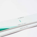 Movement Women's GO 90 Skis - White skis with black lettering and a green logo on top.