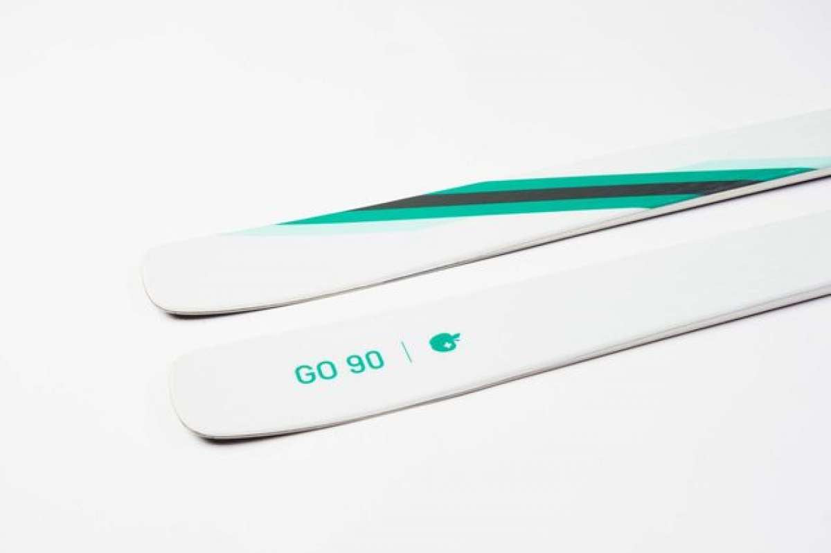 Movement Women's GO 90 Skis 2024 - White skis with green stripe on top.