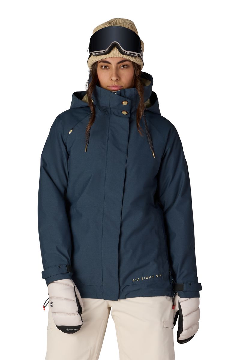 Women's 3-in-1 jacket in dark navy with hood, full-zip front, and ski patches