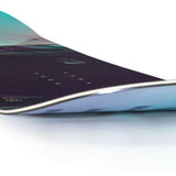 Nidecker Women's Ora Snowboard 2023 - A snowboard with a black base and blue-green gradient top, featuring a white border around its edges.