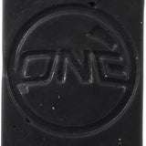 Oneball X-Wax Cold 21 - 5F 2025 - A rectangular, black wax block with illegible white text on its top surface.