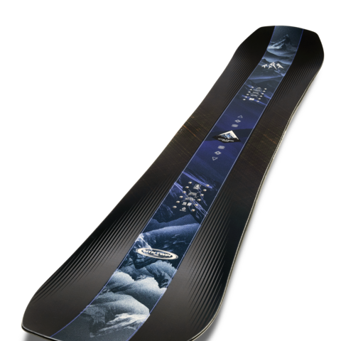 Black twin-tip snowboard in diagonal view with blue mountain artwork strip