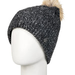 Roxy Women's Peak Chic Beanie 2025 - A black beanie with a white speckled pattern and a tan faux fur pom-pom on top.