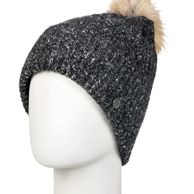 Roxy Women's Peak Chic Beanie 2025 - A black beanie with a white speckled pattern and a tan faux fur pom-pom on top.